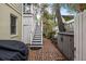 Side yard with stairs, storage, and brick path at 209 Bennett St, Mount Pleasant, SC 29464