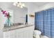 Clean bathroom with granite countertop, white cabinets and blue shower curtain at 234 Oak Park St, Summerville, SC 29486