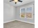 Spacious bedroom with neutral walls, ceiling fan and large windows at 234 Oak Park St, Summerville, SC 29486