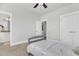 Light bedroom with gray carpet, ceiling fan and access to bathroom at 234 Oak Park St, Summerville, SC 29486
