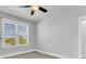 Bright bedroom with neutral walls, ceiling fan and large window at 234 Oak Park St, Summerville, SC 29486