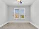 Spacious bedroom with neutral walls, ceiling fan and large windows at 234 Oak Park St, Summerville, SC 29486