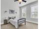 Bright bedroom with gray carpet, ceiling fan, and two windows at 234 Oak Park St, Summerville, SC 29486