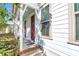Front porch with red door and brick steps at 234 Oak Park St, Summerville, SC 29486