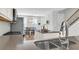 Kitchen with island, stainless steel appliances, and hardwood floors at 234 Oak Park St, Summerville, SC 29486