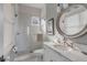 Bathroom with walk-in shower, white subway tile and marble vanity at 2618 Raven Dr, Sullivans Island, SC 29482