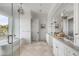 Elegant bathroom featuring a double vanity, soaking tub and walk-in shower at 2618 Raven Dr, Sullivans Island, SC 29482