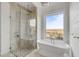 Spa-like bathroom with soaking tub, glass shower, and marsh views at 2618 Raven Dr, Sullivans Island, SC 29482