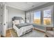 Guest bedroom with hardwood floors, comfortable bedding, and marsh views at 2618 Raven Dr, Sullivans Island, SC 29482
