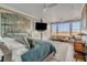 Main bedroom with water views, plush bedding, and a sitting area at 2618 Raven Dr, Sullivans Island, SC 29482