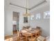 Round dining table with seating for six in a bright room at 2618 Raven Dr, Sullivans Island, SC 29482