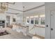 Spacious kitchen with white cabinets, marble countertops, and a large island at 2618 Raven Dr, Sullivans Island, SC 29482