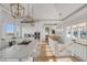 Open concept kitchen with white cabinets, marble countertops, and a center island at 2618 Raven Dr, Sullivans Island, SC 29482