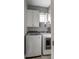 Laundry room with washer, dryer, and overhead storage at 2618 Raven Dr, Sullivans Island, SC 29482