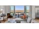 Living room with sectional sofa and access to a deck with marsh views at 2618 Raven Dr, Sullivans Island, SC 29482