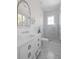 Modern bathroom with white vanity, patterned tile, and glass shower at 2723 Bayonne St, Sullivans Island, SC 29482