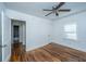 Simple bedroom with hardwood floors and a view of the hallway at 2749 E Surrey Dr, North Charleston, SC 29405