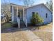 Cute blue house with a porch and steps leading to the front door at 2749 E Surrey Dr, North Charleston, SC 29405