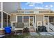 Back exterior with screened porch and brick patio at 2971 Treadwell St St, Mount Pleasant, SC 29466