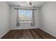 Simple bedroom with wood-look floors and a window with blinds at 2971 Treadwell St St, Mount Pleasant, SC 29466