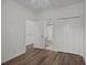 Bright bedroom with wood-look floors, ceiling fan, and ample closet space at 2971 Treadwell St St, Mount Pleasant, SC 29466