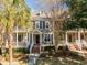 Two-story townhome with front porch, brick steps, and mature landscaping at 2971 Treadwell St St, Mount Pleasant, SC 29466