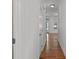 Hardwood floor hallway with neutral walls and staircase at 2971 Treadwell St St, Mount Pleasant, SC 29466
