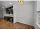 Eat-in kitchen with dark cabinetry, granite counters and hardwood floors at 2971 Treadwell St St, Mount Pleasant, SC 29466