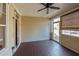 Relaxing screened porch offers a peaceful outdoor space with wood flooring and a ceiling fan at 2971 Treadwell St St, Mount Pleasant, SC 29466