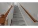 Gray carpeted staircase with wooden handrail at 2971 Treadwell St St, Mount Pleasant, SC 29466