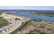 Aerial view of houses and undeveloped land near lake at 311 Calm Water Way, Summerville, SC 29486