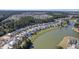 Aerial view of neighborhood and lake at 311 Calm Water Way, Summerville, SC 29486