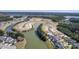 Aerial view of houses around a lake under construction at 311 Calm Water Way, Summerville, SC 29486