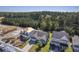 Aerial view of a charming light green house with a gray roof and a two-car garage, situated in a well-maintained neighborhood at 311 Calm Water Way, Summerville, SC 29486