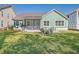 Large backyard with green grass and home exterior at 311 Calm Water Way, Summerville, SC 29486