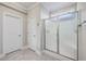 Bathroom with shower and double doors, tile floor, and neutral colors at 311 Calm Water Way, Summerville, SC 29486