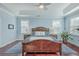 Bright bedroom with hardwood floors, a ceiling fan, and large windows at 311 Calm Water Way, Summerville, SC 29486