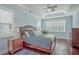 Relaxing bedroom with hardwood floors, ceiling fan and a dresser at 311 Calm Water Way, Summerville, SC 29486