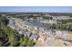An aerial view of a beautiful community with houses surrounding a lake. New construction is also visible at 311 Calm Water Way, Summerville, SC 29486