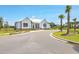 White community clubhouse with palm trees at 311 Calm Water Way, Summerville, SC 29486