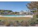 Community pool and clubhouse with lush landscaping at 311 Calm Water Way, Summerville, SC 29486