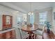 Formal dining room with hardwood floors and a wooden table with seating for four at 311 Calm Water Way, Summerville, SC 29486