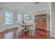 Formal dining room with hardwood floors and a wooden table with seating for four at 311 Calm Water Way, Summerville, SC 29486