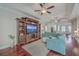 Spacious living room features hardwood floors, a large entertainment center, and comfortable seating at 311 Calm Water Way, Summerville, SC 29486