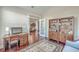 Bright home office with hardwood floors, built-in shelves, and a work desk at 311 Calm Water Way, Summerville, SC 29486