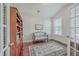 Home office with hardwood floors, built-in shelves, and a comfortable couch at 311 Calm Water Way, Summerville, SC 29486