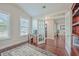Spacious home office with hardwood floors, built-in shelves, and a work desk at 311 Calm Water Way, Summerville, SC 29486