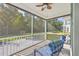 Relaxing screened porch overlooking backyard with seating area at 311 Calm Water Way, Summerville, SC 29486