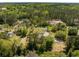 Expansive aerial view of a beautiful home nestled amongst lush greenery and mature trees at 3324 Westphal Dr, Johns Island, SC 29455