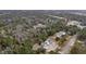 Expansive aerial view of a new home construction nestled among lush trees and greenery in a serene setting at 3324 Westphal Dr, Johns Island, SC 29455